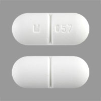 Pill M 057 White Oval is Sucralfate