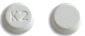 Pill K 2 White Round is Ondansetron Hydrochloride (Orally Disintegrating)