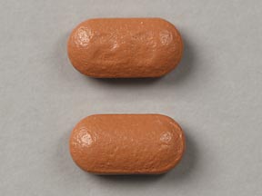 Pill 20 Brown Elliptical/Oval is Omeprazole Delayed Release
