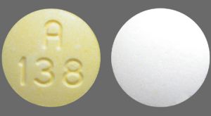 Pill A 138 Yellow & White Round is Aspirin, Carisoprodol and Codeine