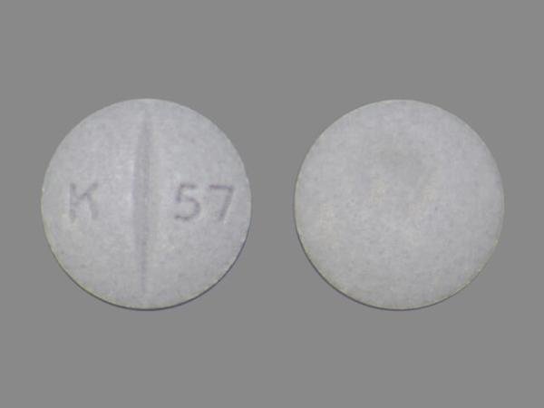 Pill K 57 Gray Round is Oxycodone Hydrochloride