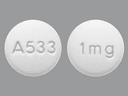 Pill A533 1 mg White Round is Guanfacine Hydrochloride Extended-Release