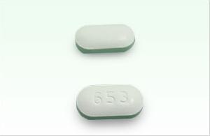 Pill 653 White Capsule/Oblong is Glyburide and Metformin Hydrochloride