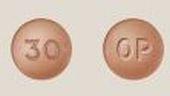 Pill OP 30 Brown Round is Oxycodone Hydrochloride Extended-Release