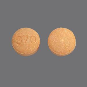 Pill 970 Orange Round is Buprenorphine Hydrochloride and Naloxone Hydrochloride (Sublingual)