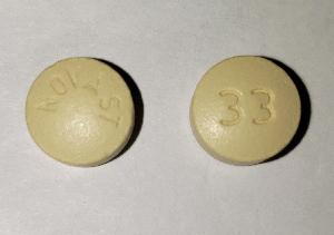 Pill NOVAST 33 Yellow Round is Nifedipine Extended-Release