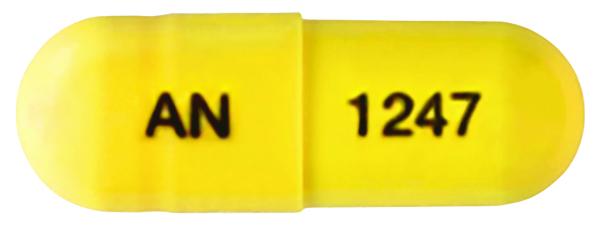 Pill AN 1247 Yellow Capsule/Oblong is Donepezil Hydrochloride and Memantine Hydrochloride Extended-Release
