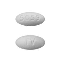 Pill TV 5059 White Oval is Atorvastatin Calcium