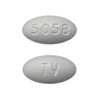 Pill TV 5058 White Oval is Atorvastatin Calcium