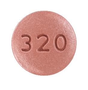 Pill KU 320 Red Round is Niacin Extended-Release