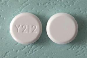 Pill Y212  White Round is Acyclovir