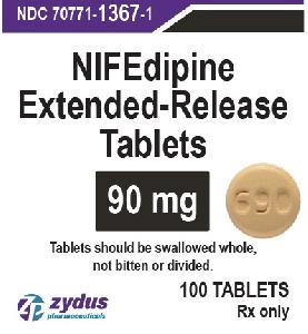 Pill 690 Brown Round is Nifedipine Extended-Release