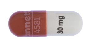 Pill Lannett 4581 30 mg Red & White Capsule-shape is Methylphenidate Hydrochloride Extended-Release (CD)