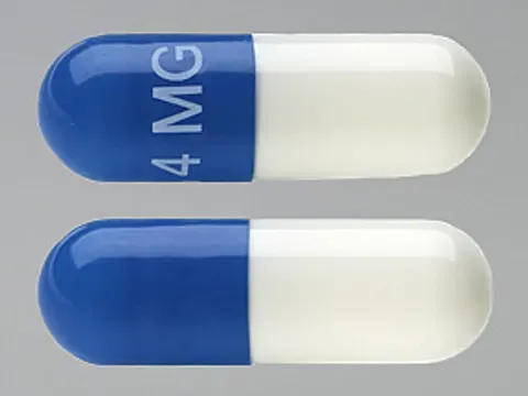 Pill 4 MG Blue & White Capsule/Oblong is Tizanidine Hydrochloride