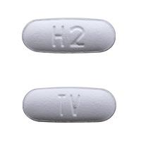 Pill TV H2 White Capsule/Oblong is Minocycline Hydrochloride Extended-Release