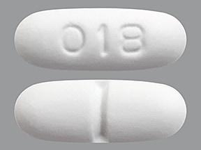 Pill 018 White Capsule/Oblong is Tramadol Hydrochloride