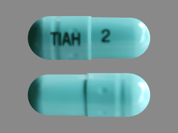 Pill TIAH 2 Green Capsule/Oblong is Tizanidine Hydrochloride