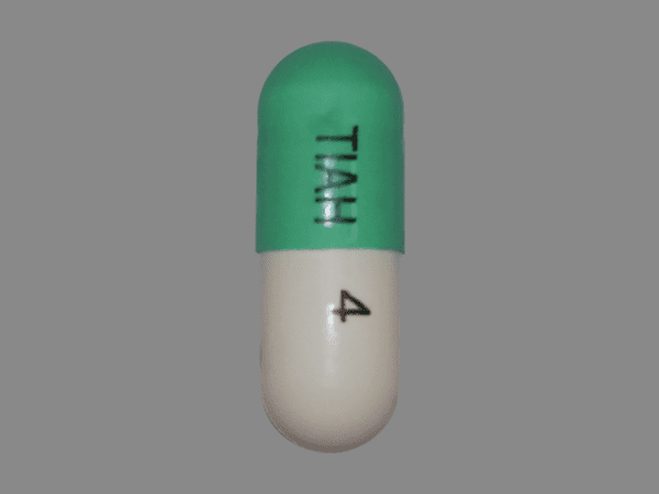 Pill TIAH 4 Green & White Capsule/Oblong is Tizanidine Hydrochloride