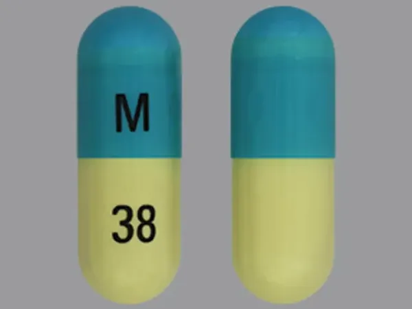 Pill M 38 Blue Capsule/Oblong is Clomipramine Hydrochloride
