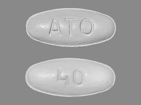 Pill ATO 40 White Oval is Atorvastatin Calcium