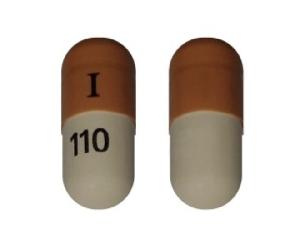 Pill I 110 Brown & White Capsule/Oblong is Atomoxetine Hydrochloride