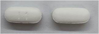 Pill I1 White Capsule/Oblong is Acetaminophen, Aspirin and Caffeine