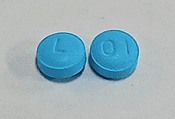 Pill L 01 Blue Round is Desipramine Hydrochloride