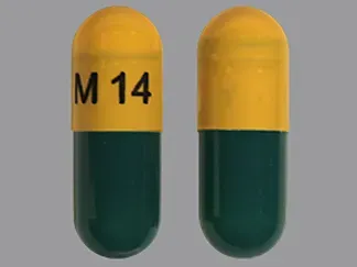 Pill M 14 Green & Yellow Capsule/Oblong is Memantine Hydrochloride Extended-Release