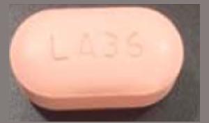 Pill LA36 Pink Capsule/Oblong is Efavirenz, Emtricitabine and Tenofovir Disoproxil Fumarate