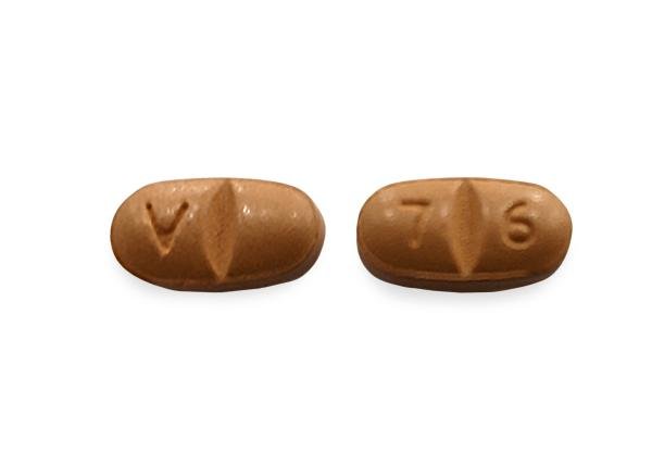 Pill V 7 6 Brown Oval is Oxcarbazepine