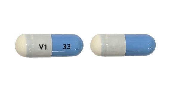 Pill V1 33 Blue & White Capsule/Oblong is Mexiletine Hydrochloride