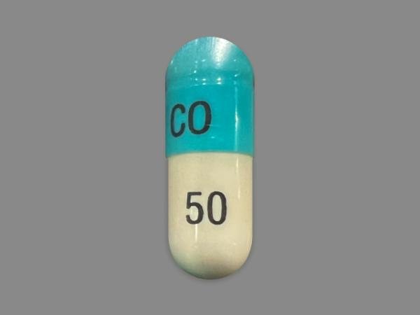 Pill CO 50 Blue & White Capsule/Oblong is Clomipramine Hydrochloride