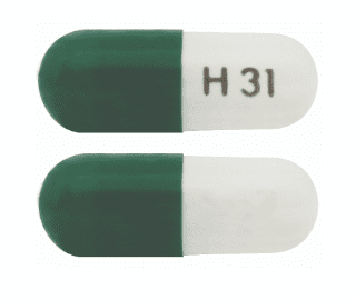 Pill H31 Green & White Capsule/Oblong is Carvedilol Phosphate Extended Release