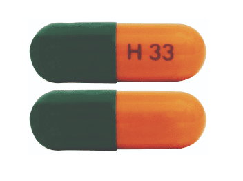 Pill H33 Green & Orange Capsule/Oblong is Carvedilol Phosphate Extended Release