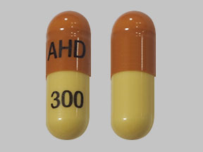 Pill AHD 300 Brown & Yellow Capsule-shape is Gabapentin
