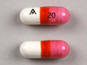 Pill logo 20 Pink & White Capsule/Oblong is Diphenhist