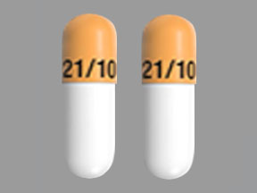 Pill FL 21/10 Orange & White Capsule-shape is Namzaric