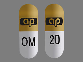 Pill ap OM 20 Orange & White Capsule-shape is Omeprazole and Sodium Bicarbonate