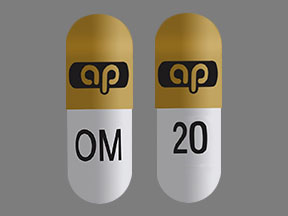 Pill ap OM 20 Orange & White Capsule/Oblong is Omeprazole and Sodium Bicarbonate