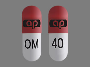 Pill ap OM 40 Pink & White Capsule-shape is Omeprazole and Sodium Bicarbonate