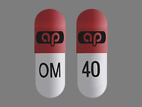 Pill ap OM 40 Pink & White Capsule/Oblong is Omeprazole and Sodium Bicarbonate