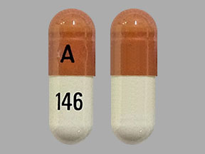 Pill A 146 Orange & White Capsule-shape is Pregabalin