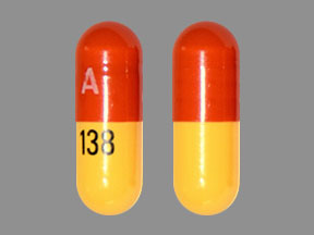 Pill A 138 Brown & Yellow Capsule/Oblong is Fenofibric Acid Delayed-Release