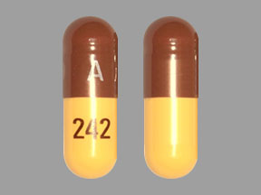 Pill A 242 Brown & Yellow Capsule/Oblong is Doxycycline Monohydrate
