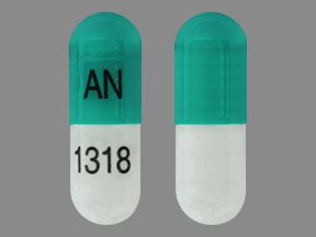 Pill AN 1318 Green & White Capsule-shape is Dimethyl Fumarate Delayed-Release