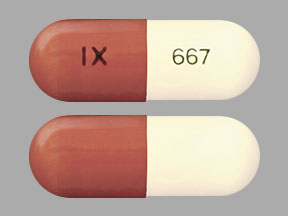 Pill IX 667 Brown & White Capsule/Oblong is Acitretin