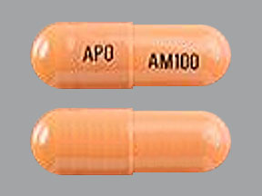 Pill APO AM100 Orange Capsule/Oblong is Atomoxetine Hydrochloride