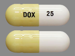 Pill DOX 25 Beige Capsule/Oblong is Doxepin Hydrochloride