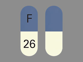 Pill F 26 Blue & White Capsule/Oblong is Ziprasidone Hydrochloride