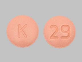 Pill K 29 Peach Round is Amlodipine Besylate and Olmesartan Medoxomil